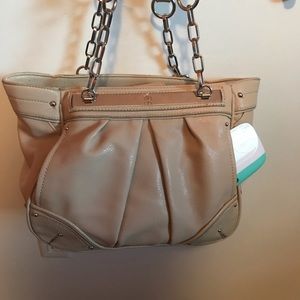 Jennifer Lopez purse with side pockets